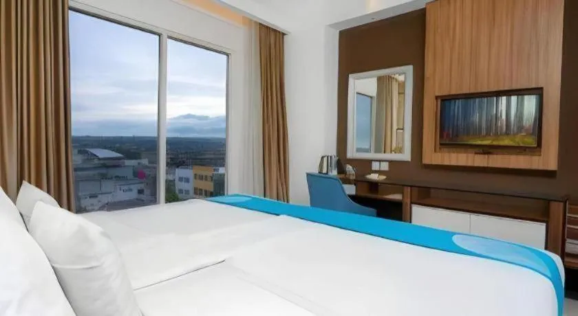 Bed in Java Lotus Hotel Jember