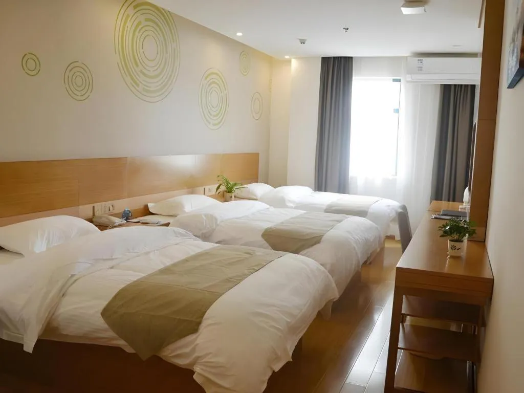 Bed in GreenTree Inn Anqing Wangjiang County Lantian Road Yiheyuan Express Hotel