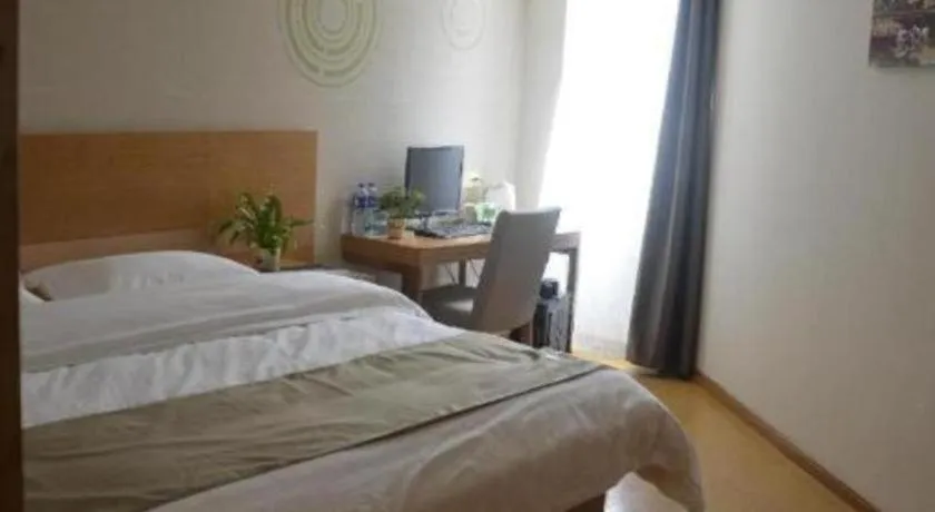 Bed in GreenTree Inn Anqing Wangjiang County Lantian Road Yiheyuan Express Hotel