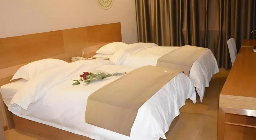Bed in GreenTree Inn Anqing Wangjiang County Lantian Road Yiheyuan Express Hotel