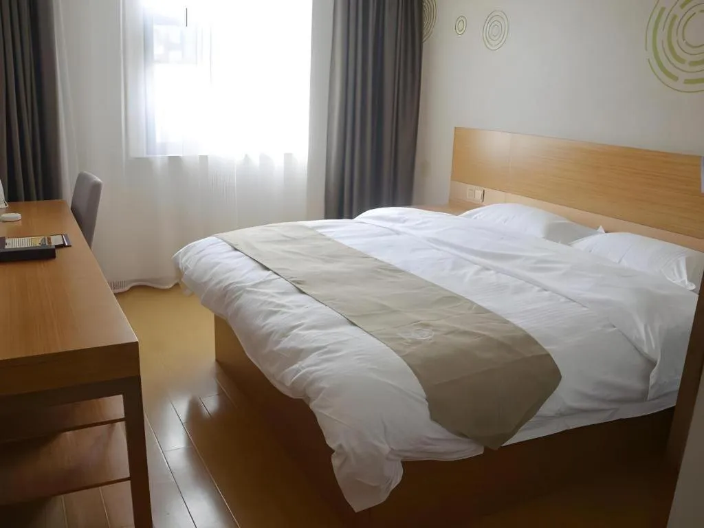 Bed in GreenTree Inn Anqing Wangjiang County Lantian Road Yiheyuan Express Hotel