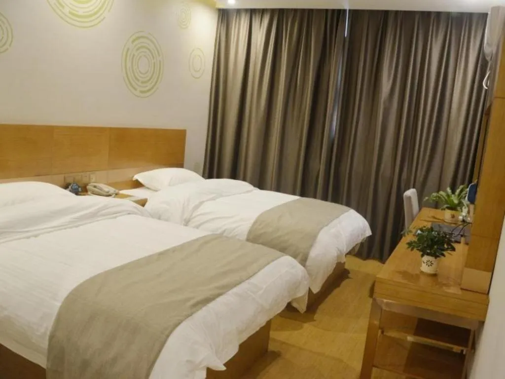 Bed in GreenTree Inn Anqing Wangjiang County Lantian Road Yiheyuan Express Hotel