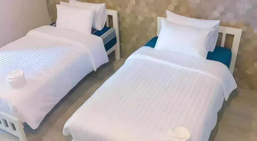 Bed in Kosit One Hotel Bed in Kosit One Hotel