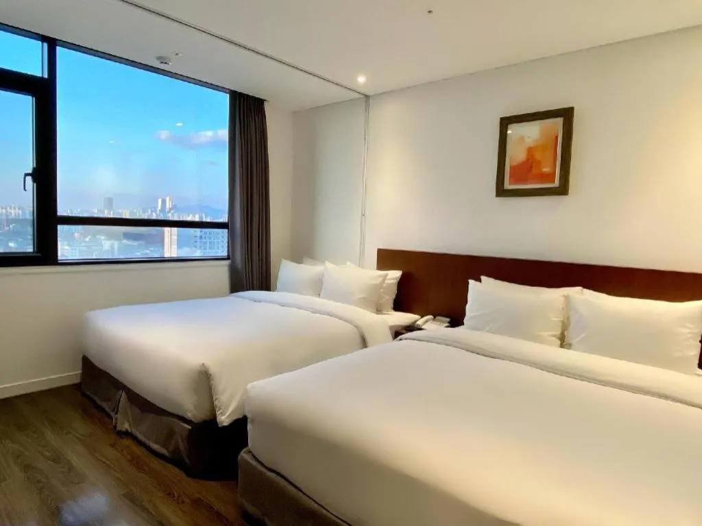 Bed in CS Premier Hotel