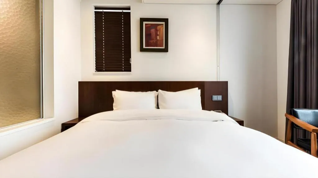 Bed in CS Premier Hotel