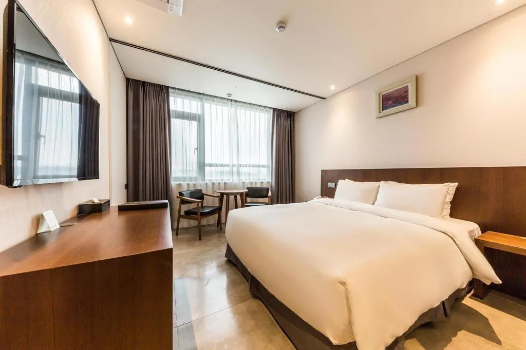 Bed in CS Premier Hotel