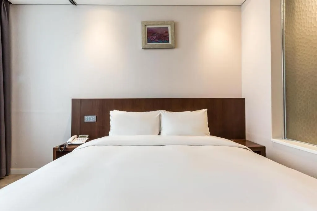 Bed in CS Premier Hotel