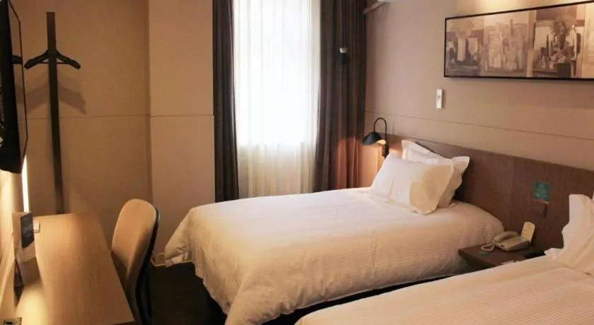 Bed in Jinjiang Inn Select Shenyang Tawan Xingshun Night Market Metro Station