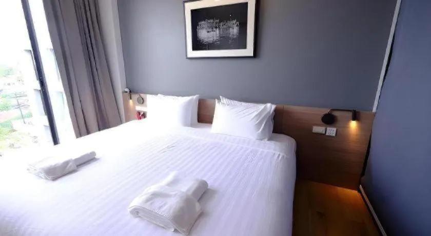 Bed in R Photo Hotel