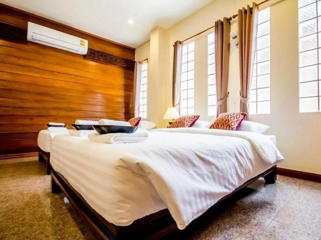 Bed in Wake Up at Muang Kao Boutique Hotel