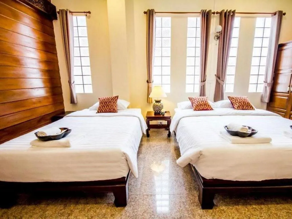 Bed in Wake Up at Muang Kao Boutique Hotel