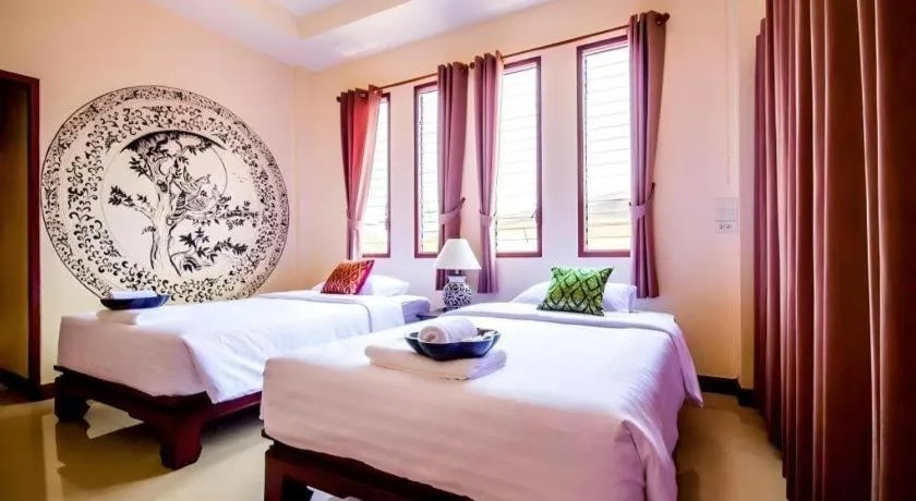 Bed in Wake Up at Muang Kao Boutique Hotel