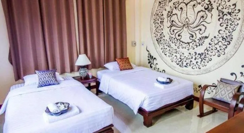 Bed in Wake Up at Muang Kao Boutique Hotel