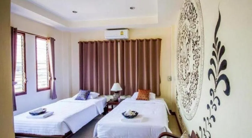 Bed in Wake Up at Muang Kao Boutique Hotel