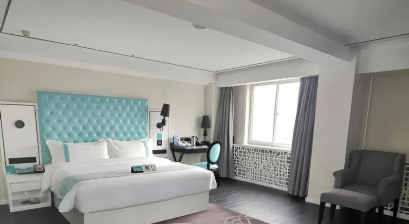 Bed in Xana Hotelle Beijing Qianmen Footbridge Metro Station