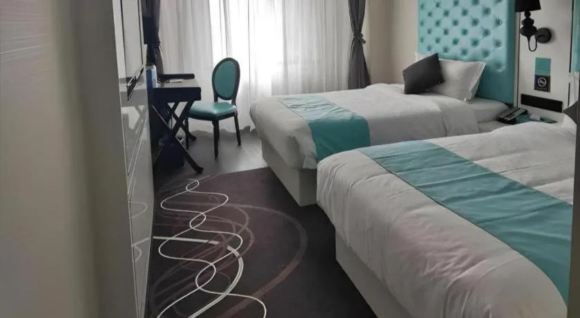 Bed in Xana Hotelle Beijing Qianmen Footbridge Metro Station