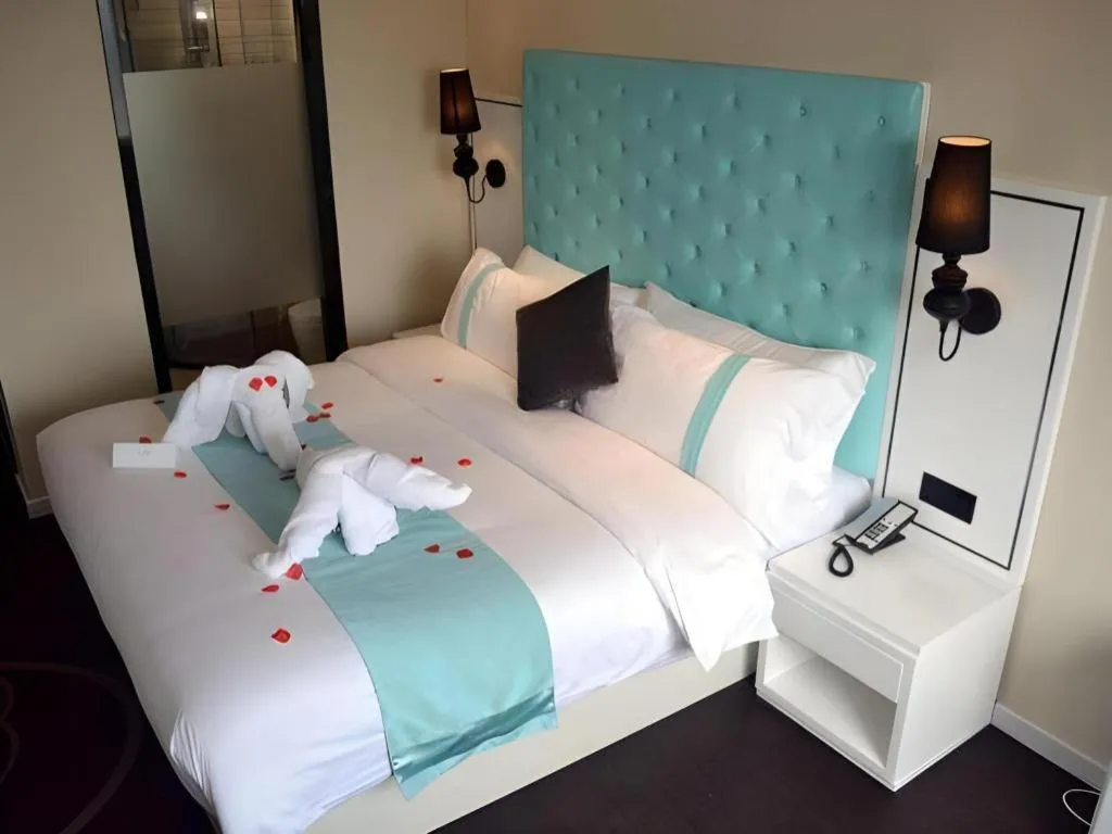 Bed in Xana Hotelle Beijing Qianmen Footbridge Metro Station