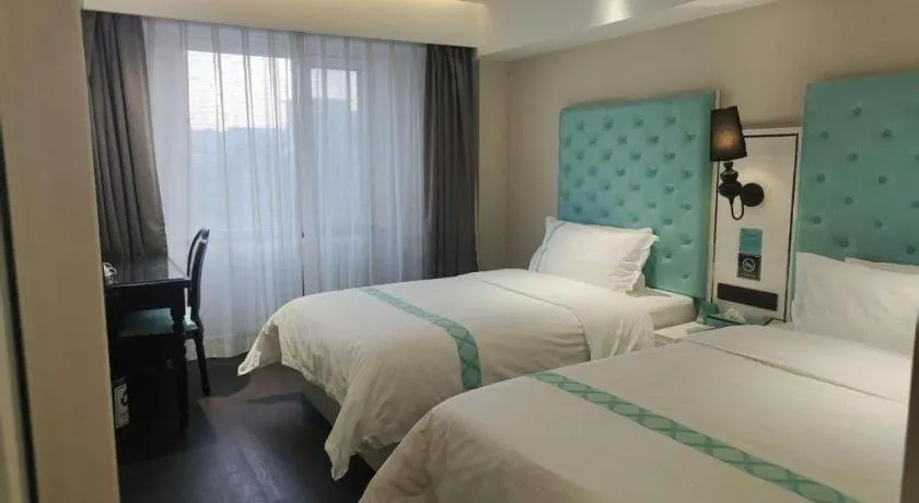 Bed in Xana Hotelle Beijing Qianmen Footbridge Metro Station