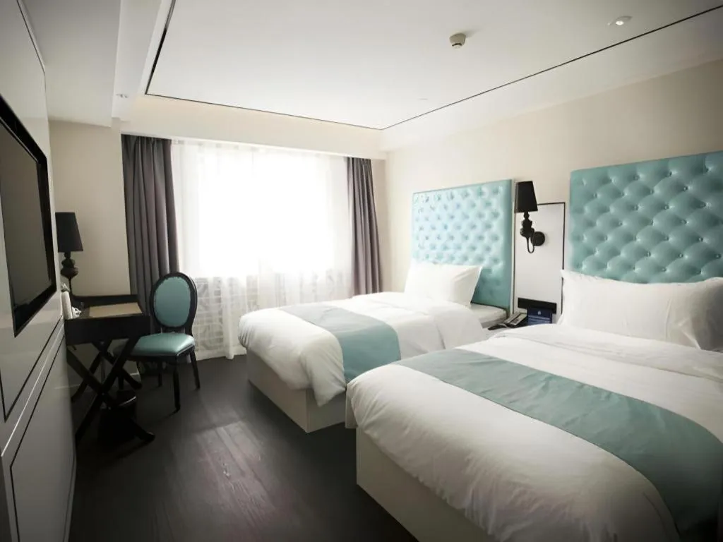 Bed in Xana Hotelle Beijing Qianmen Footbridge Metro Station