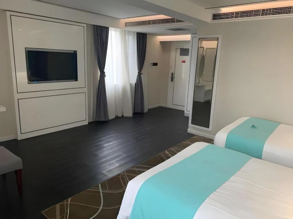 Bed in Xana Hotelle Beijing Qianmen Footbridge Metro Station