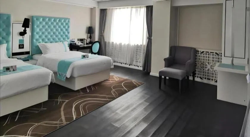 Bed in Xana Hotelle Beijing Qianmen Footbridge Metro Station