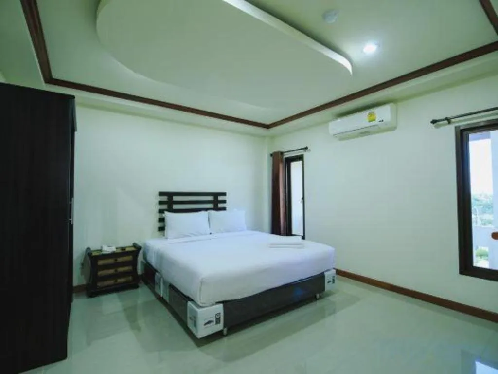 Bed in AmornSukhothai Hotel