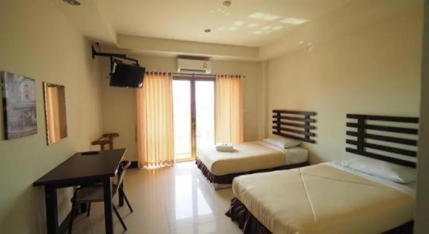 Bed in AmornSukhothai Hotel