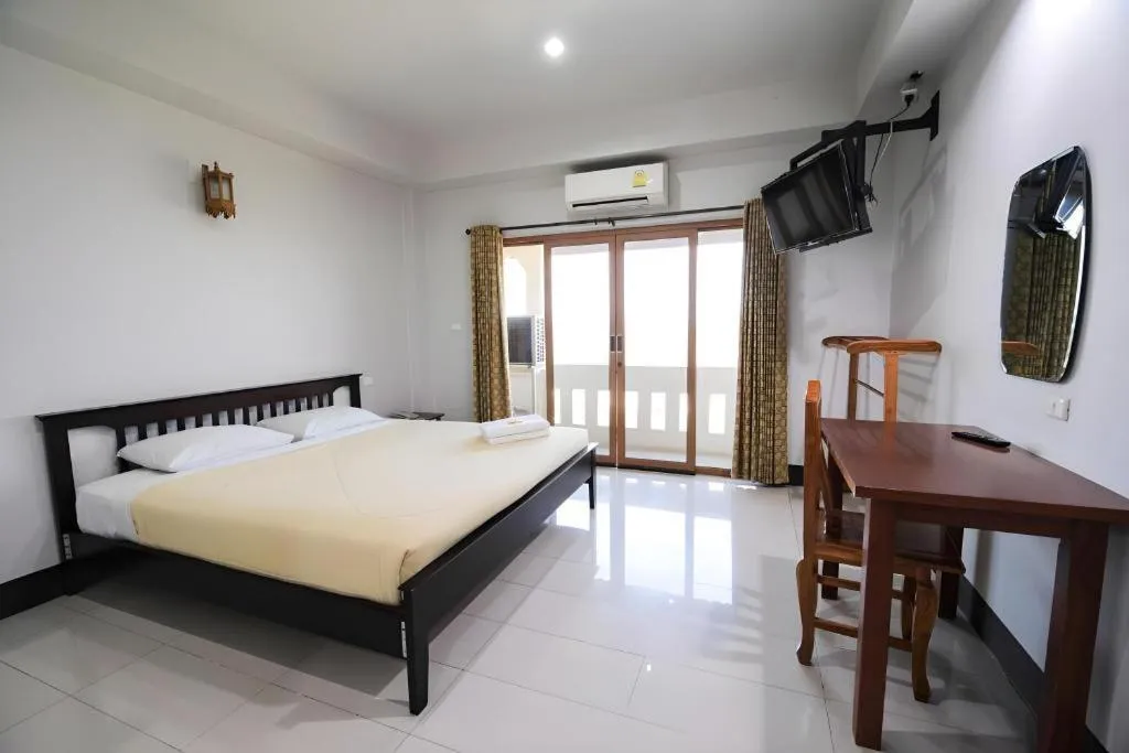 Bed in AmornSukhothai Hotel