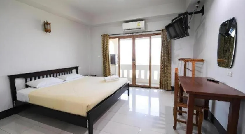 Bed in AmornSukhothai Hotel