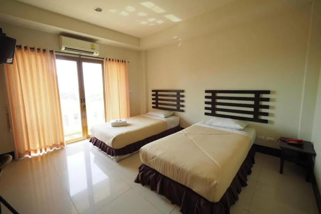 Bed in AmornSukhothai Hotel