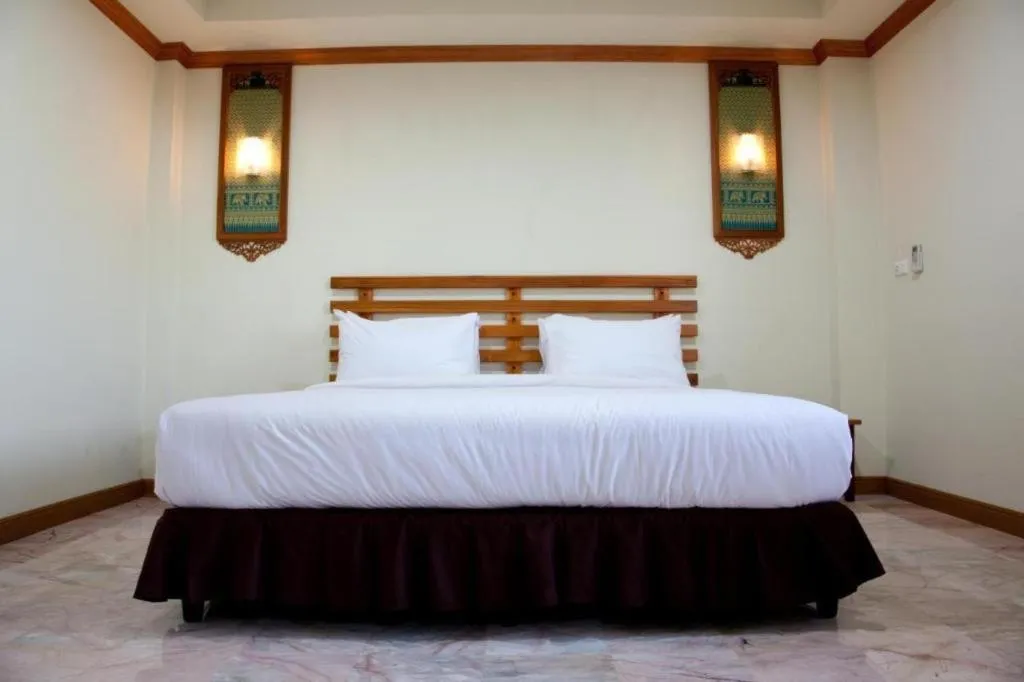 Bed in AmornSukhothai Hotel
