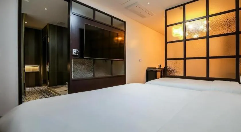 Bed in Hotel Morning Calm