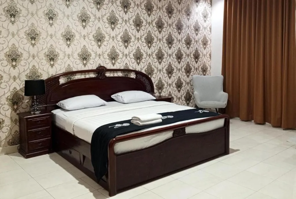 Bed in The Garden Hotel