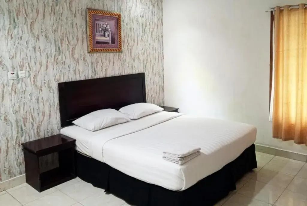 Bed in The Garden Hotel Bed in The Garden Hotel