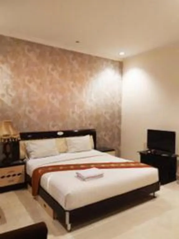 Bed in The Garden Hotel