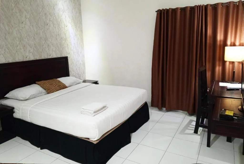 Bed in The Garden Hotel