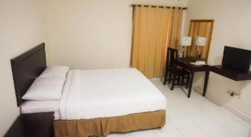 Bed in The Garden Hotel