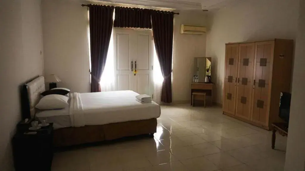 Bed in The Garden Hotel Bed in The Garden Hotel