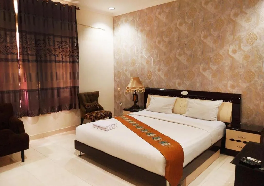 Bed in The Garden Hotel