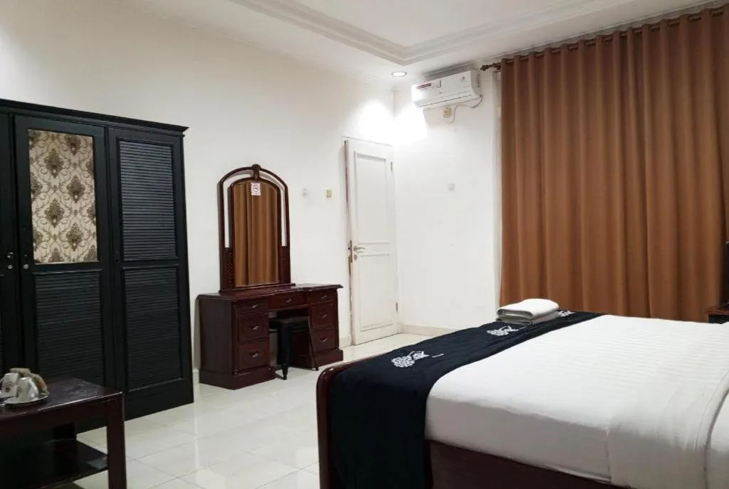 Bed in The Garden Hotel