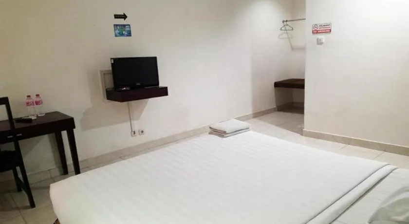 Bed in The Garden Hotel