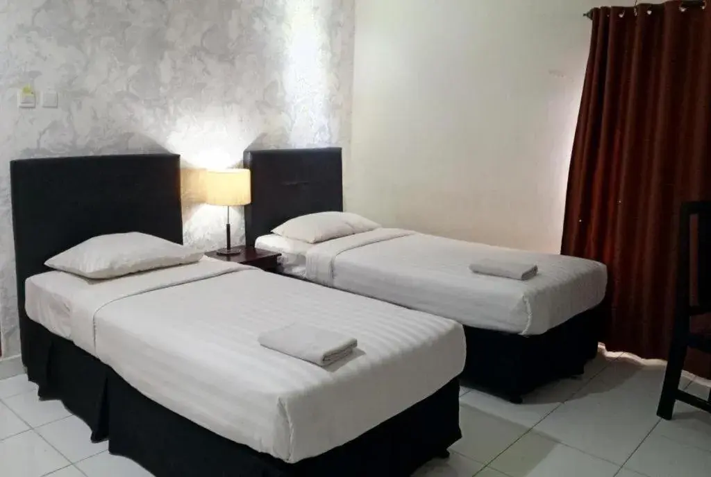 Bed in The Garden Hotel Bed in The Garden Hotel