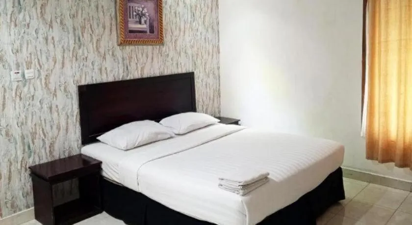 Bed in The Garden Hotel