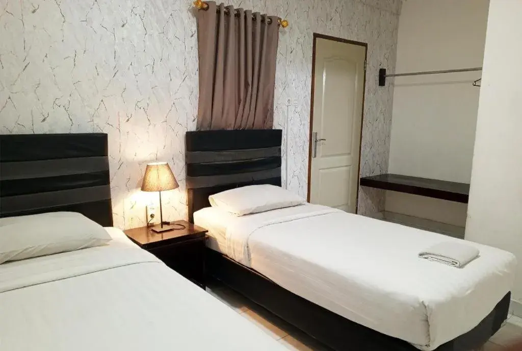 Bed in The Garden Hotel Bed in The Garden Hotel