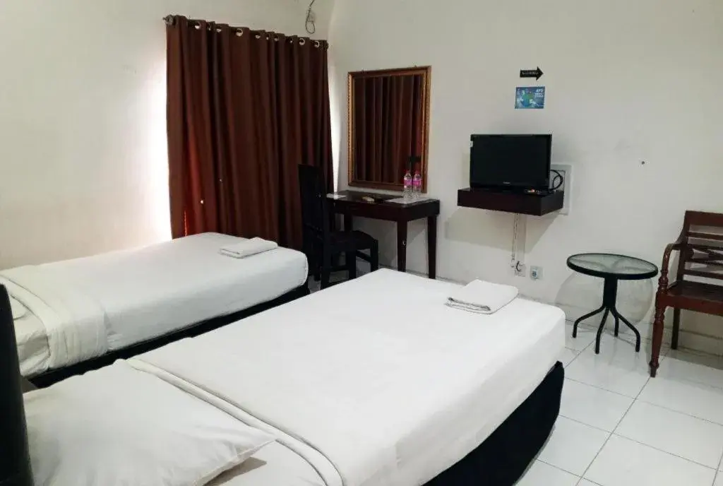 Bed in The Garden Hotel Bed in The Garden Hotel