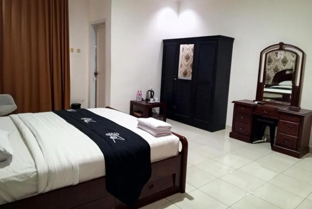 Bed in The Garden Hotel