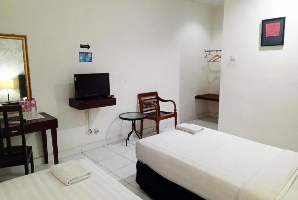 Bed in The Garden Hotel