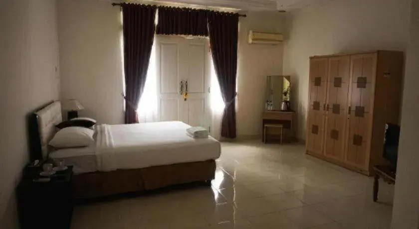 Bed in The Garden Hotel Bed in The Garden Hotel