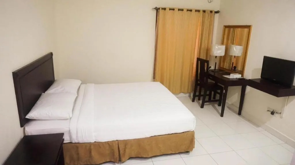 Bed in The Garden Hotel