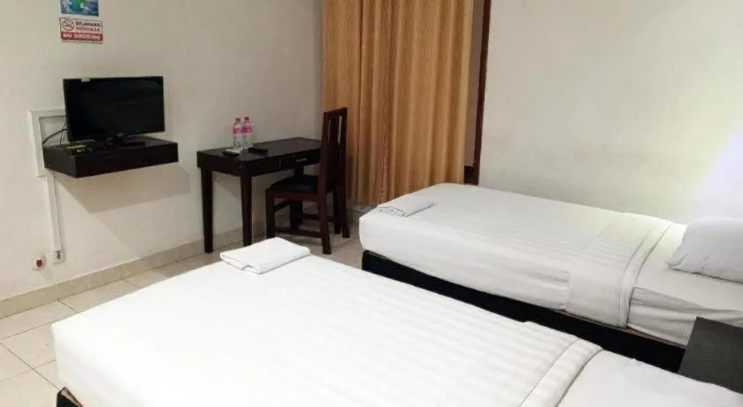 Bed in The Garden Hotel